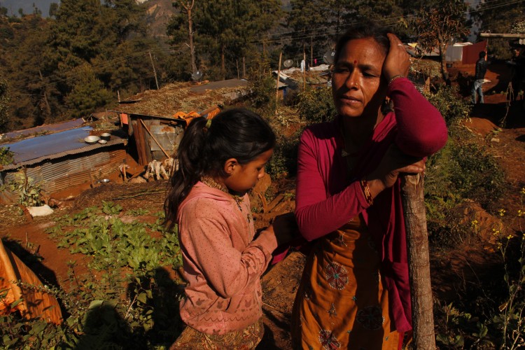 Saraswati Chuhan with her daughter near their temporary shelter in Sailibhanjyang village in Sindhupalchowk. Photo: Bhrikuti Rai