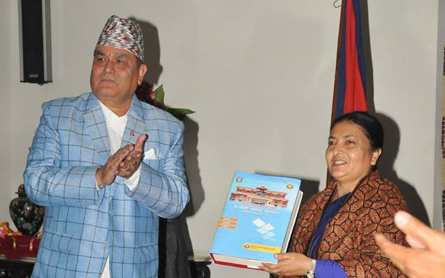 CIAA chief commissioner Lokman Singh Karki (left) presents CIAA annual report to President Bidya Bhandari in Kathmandu on February 4. Photo Courtesy: Facebook page of CIAA